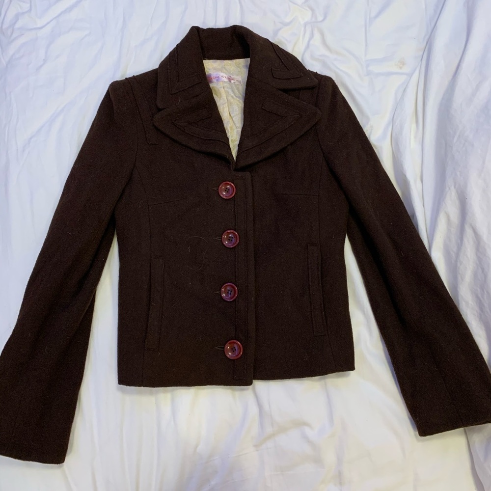 brown jacket with purple buttons